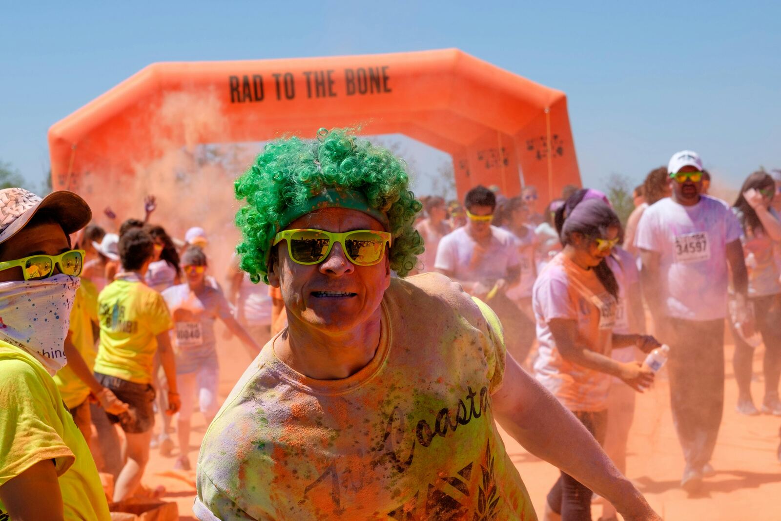 Color run participants covered in bright powder
