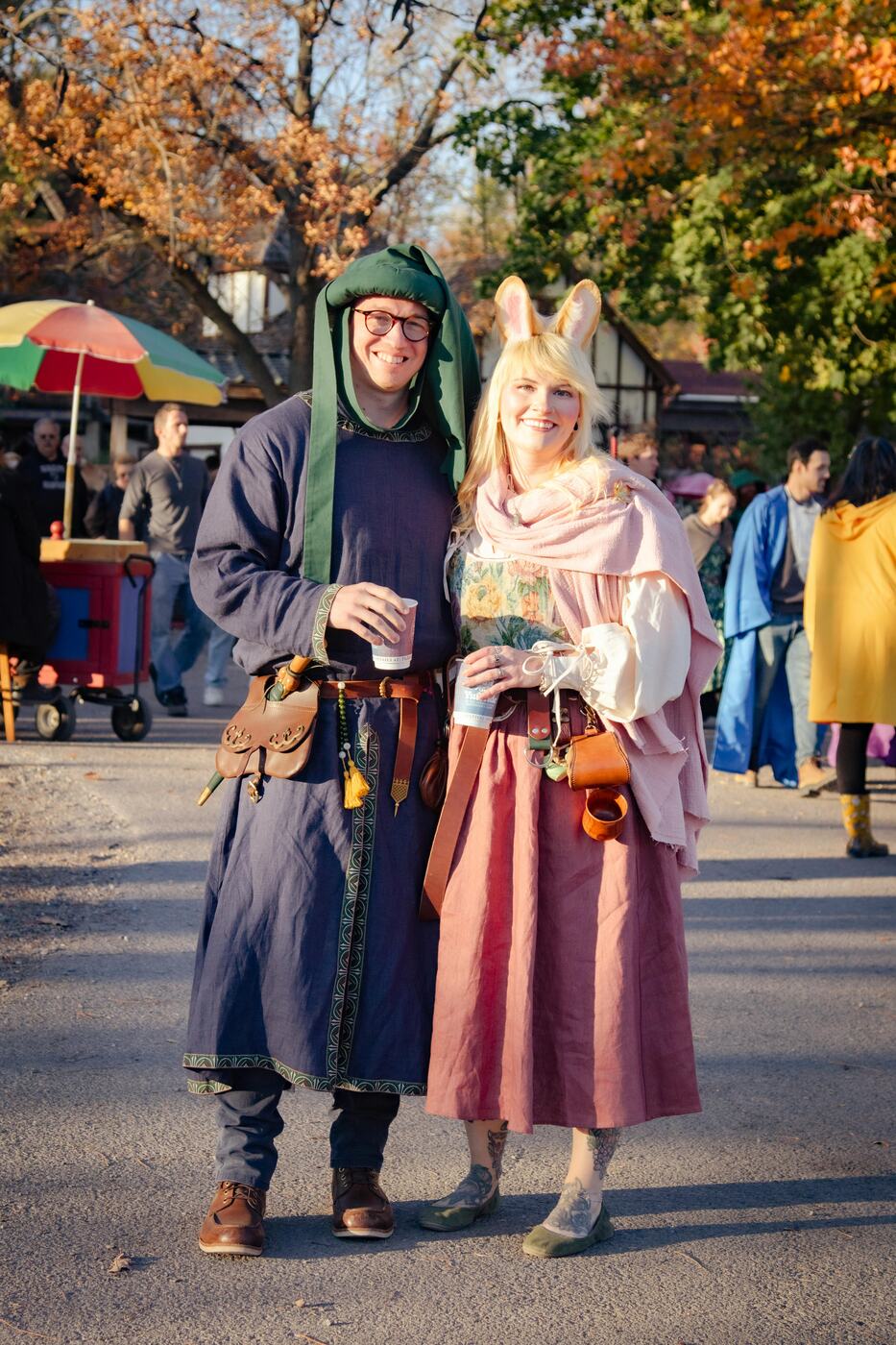 Renaissance fair attendees in costume for the festival route